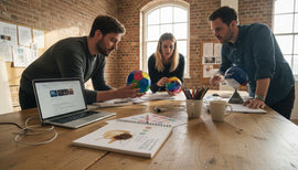 Designers comparing 3D color wheels in studio